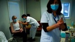 A nurse administrates a Pfizer/Biontech COVID-19 vaccine dose to a health care worker .(AP) A nurse administrates a Pfizer/Biontech COVID-19 vaccine dose to a health care worker .(AP)