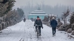A cyclists rides on a slippery snow covered road after a brief snowfall in Srinagar, Indian controlled Kashmir.(AP) A cyclists rides on a slippery snow covered road after a brief snowfall in Srinagar, Indian controlled Kashmir.(AP)