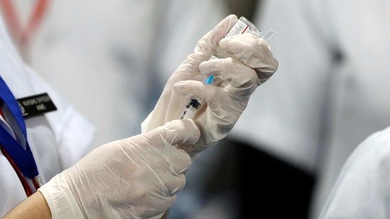 A healthcare worker fills a syringe with a dose of Bharat Biotech's Covid-19 vaccine called Covaxin, during the coronavirus disease (Covid-19) vaccination campaign at All India Institute of Medical Sciences (AIIMS) hospital in New Delhi, India,(Reuters)