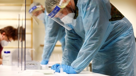 German soldier helping in elderly nursing home of Germany's Red Cross as the spread of the coronavirus disease continues during an extended lockdown. (REUTERS)