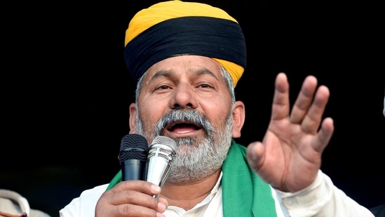 BKU leader Rakesh Tikait addresses during an ongoing farmer's protest against the new farm laws, at the Delhi-Ghazipur border in New Delhi on Thursday. (ANI Photo) BKU leader Rakesh Tikait addresses during an ongoing farmer's protest against the new farm laws, at the Delhi-Ghazipur border in New Delhi on Thursday. (ANI Photo)