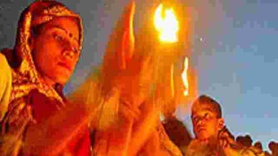 Hindu devotees offer evening prayers on the banks of the Ganges in Allahabad on Saturday, May 26, 2007. Hindus across the country are celebrating Ganga Dussehra, devoted to the worship of the river.