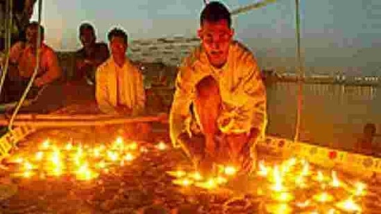 Hindu devotees offer evening prayers on the banks of the Ganges on Ganga Dussehra.