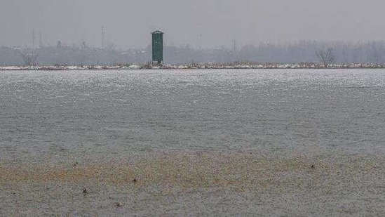 A watchtower to monitor birds is surrounded by a thick layer of frozen ice in Hokersar, north of Srinagar, Indian controlled Kashmir, Friday, Jan. 22, 2021.(AP)