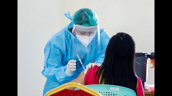 Despite a number of steps taken by the authorities, including counselling sessions and discussions to counter hesitancy among workers, most are not willing to be vaccinated. (Reuters File Photo) Despite a number of steps taken by the authorities, including counselling sessions and discussions to counter hesitancy among workers, most are not willing to be vaccinated. (Reuters File Photo)