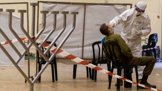 A medical professional tests an Israeli soldier for coronavirus in Elad, Israel, Tuesday, Feb. 2, 2021.(AP)