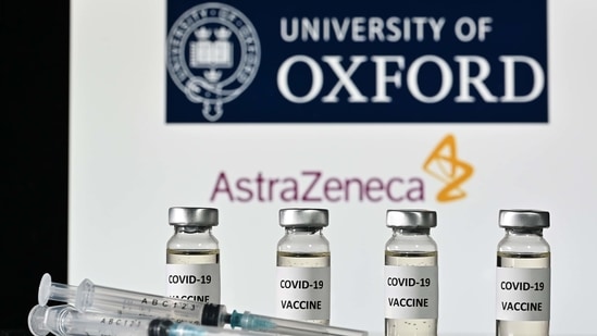 (FILES) This file illustration photo taken on November 17, 2020 shows vials with Covid-19 Vaccine stickers attached and syringes, with the logo of the University of Oxford and its partner British pharmaceutical company AstraZeneca. - France will decide on February 2, 2021 if the Covid-19 vaccine manufactured by AstraZeneca can be used to vaccinate elderly recipients. (Photo by JUSTIN TALLIS / AFP)(AFP)