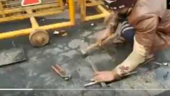 Iron nails studded on Ghazipur roads. (ANI Photo/Screengrab )