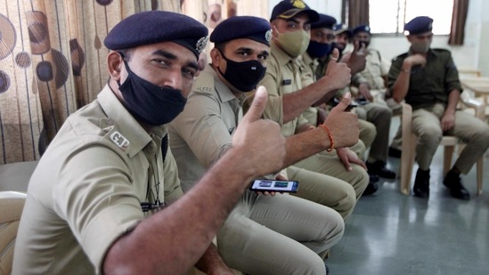 Police personnel after receiving the first dose of Covishield vaccine at Sola Civil Hospital in Ahmedabad. (PTI) Police personnel after receiving the first dose of Covishield vaccine at Sola Civil Hospital in Ahmedabad. (PTI)