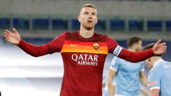 Roma's Edin Dzeko after missing a chance during the Serie A soccer match between Lazio and Roma, at Rome's Olympic Stadium, Friday, Jan. 15, 2021. (AP Photo/Andrew Medichini)(AP)