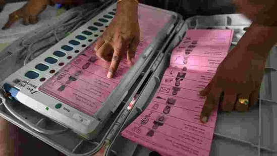 A polling staff tallies the candidates’ names on the Electronic Voting Machines (EVM) during Karnataka elections, in Bengaluru, May 11, 2018. While many developed countries are studying India’s electronic voting system, many parties in India want to go back to the paper ballot. (Arijit Sen/HT Photo) A polling staff tallies the candidates’ names on the Electronic Voting Machines (EVM) during Karnataka elections, in Bengaluru, May 11, 2018. While many developed countries are studying India’s electronic voting system, many parties in India want to go back to the paper ballot. (Arijit Sen/HT Photo)