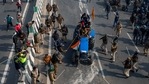 In this Tuesday, Jan.26, 2021, file photo, Indian policemen beat farmers driving a tractor towards the heart of the city as a sign of protest against new farm laws, during India's Republic Day celebrations in New Delhi, India. (AP) In this Tuesday, Jan.26, 2021, file photo, Indian policemen beat farmers driving a tractor towards the heart of the city as a sign of protest against new farm laws, during India's Republic Day celebrations in New Delhi, India. (AP)