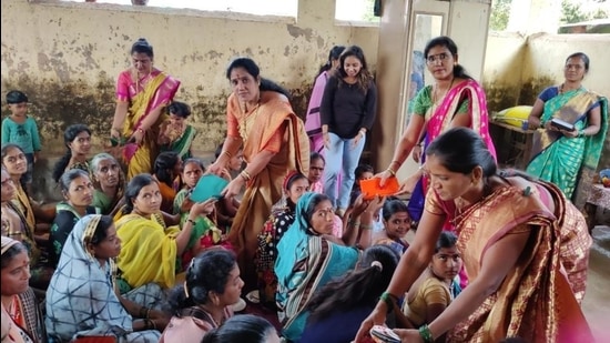 Adivasi women in Murbad get sanitary napkins. (HT photo) Adivasi women in Murbad get sanitary napkins. (HT photo)