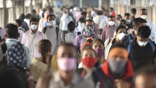 Commuters walk on a crowded railway platform as authorities permitted all members of the general public to travel in local trains, after a gap of about 320 days owing to the coronavirus pandemic, in Thane, Monday, Feb. 1, 2021. (PTI)