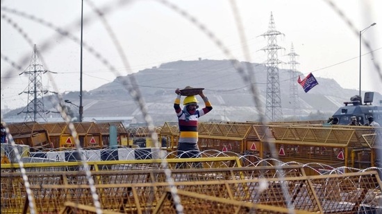 Security tightened during an ongoing farmer's protest against the new farm laws, at the Delhi-Ghazipur border in New Delhi on Thursday. (ANI) Security tightened during an ongoing farmer's protest against the new farm laws, at the Delhi-Ghazipur border in New Delhi on Thursday. (ANI)
