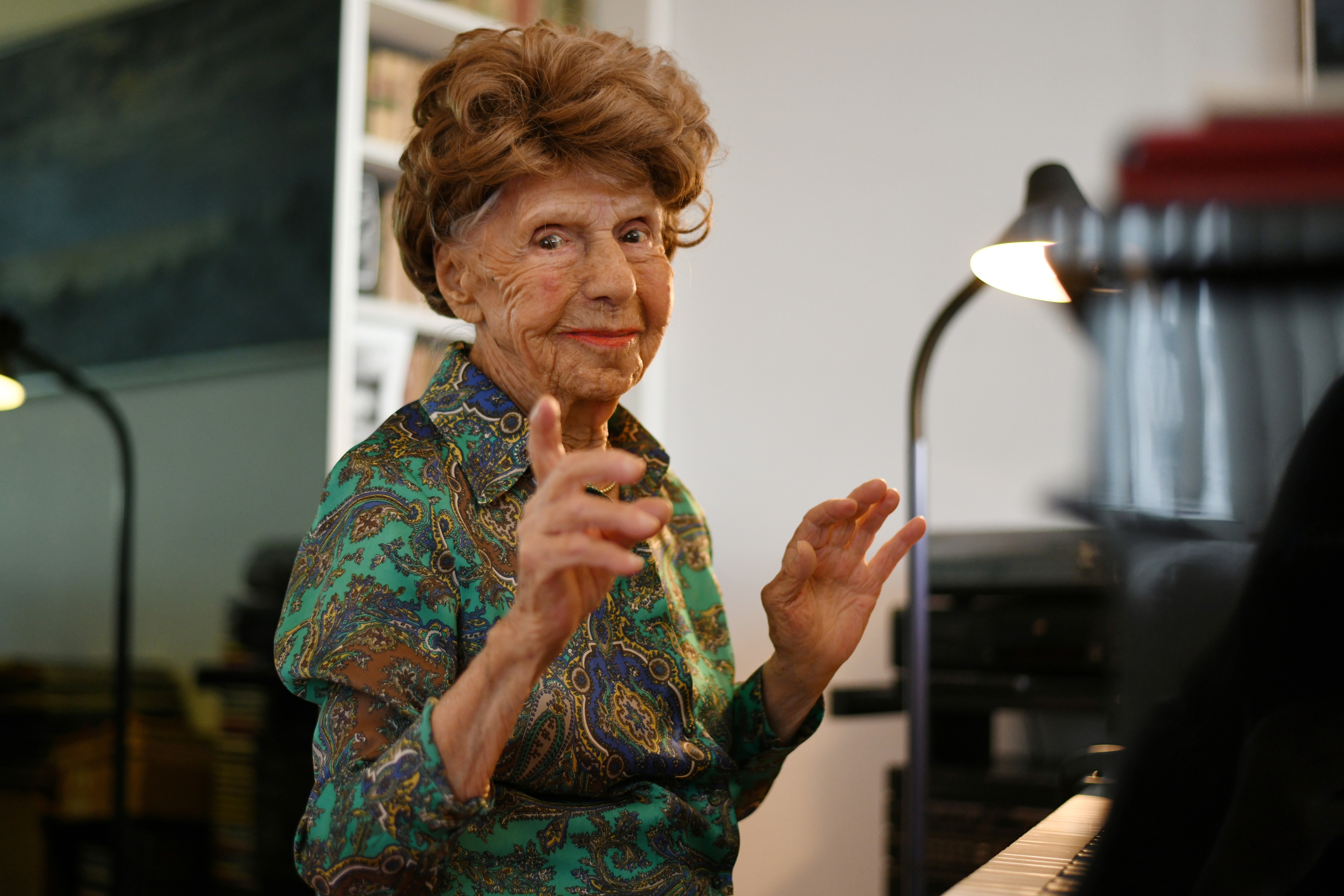 Parisian pianist Colette Maze, 106 years old, poses at her home in Paris, France. (REUTERS)