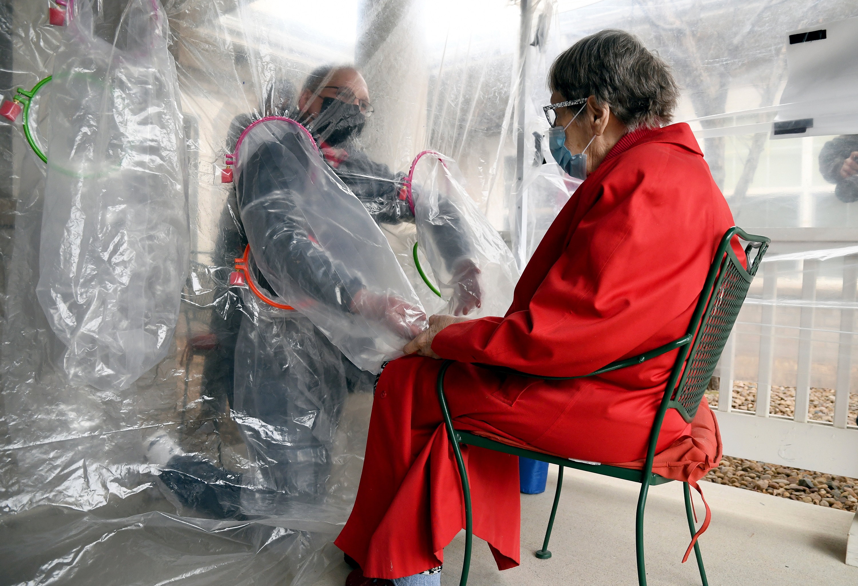 Gregg MacDonald holds hands with his 84-year-old mother, Chloe MacDonald, at a "hug tent" set up.(AP) Gregg MacDonald holds hands with his 84-year-old mother, Chloe MacDonald, at a "hug tent" set up.(AP)