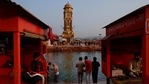 Hindu pilgrims take holy dips in the river Ganges as priests sit in their makeshift cabins at Har ki Pauri in Haridwar, India, Friday, Jan. 15, 2021. (AP) Hindu pilgrims take holy dips in the river Ganges as priests sit in their makeshift cabins at Har ki Pauri in Haridwar, India, Friday, Jan. 15, 2021. (AP)