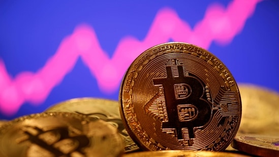 FILE PHOTO: A representation of virtual currency Bitcoin is seen in front of a stock graph in this illustration taken January 8, 2021. REUTERS/Dado Ruvic/File Photo(REUTERS)