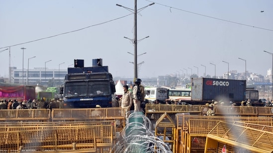 Barricades being put up as security on high alert during Chakka Jam by farmers against farm bills, at the Delhi-Ghazipur border in New Delhi on Saturday. (ANI Photo)