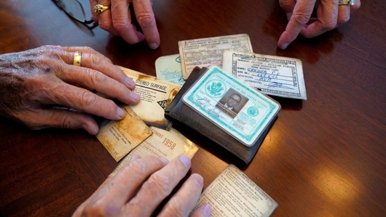 Paul Grisham and his wife Carole Salazar look over his wallet and the items that were inside when he lost it in Antarctica back in 1968 at their home in the San Carlos neighborhood of San Diego, Calif., Wednesday, Feb. 3, 2021. (AP) Paul Grisham and his wife Carole Salazar look over his wallet and the items that were inside when he lost it in Antarctica back in 1968 at their home in the San Carlos neighborhood of San Diego, Calif., Wednesday, Feb. 3, 2021. (AP)