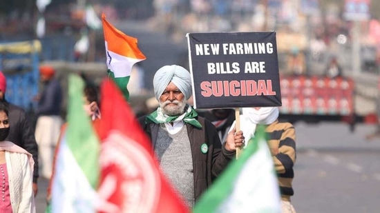 Farmers stage protest against the new farm laws.