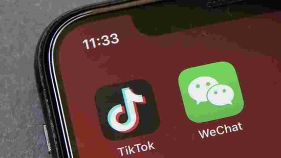Icons for the smartphone apps TikTok and WeChat are seen on a smartphone screen in Beijing. (AP File) Icons for the smartphone apps TikTok and WeChat are seen on a smartphone screen in Beijing. (AP File)