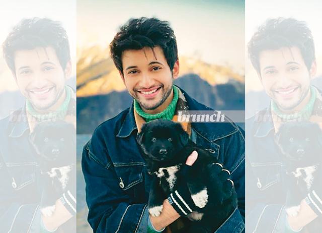 Guess who made a friend in the hills? Rohit Saraf poses with a pupper during a recent trip to the hills
