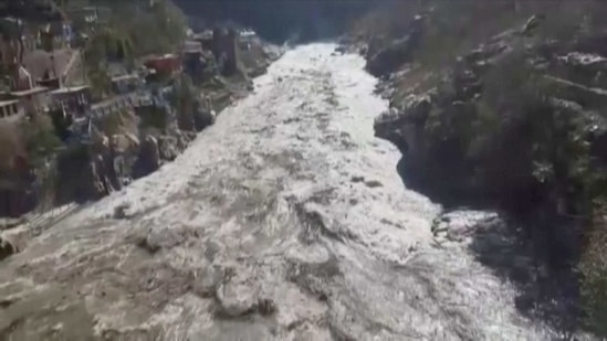 The water level in the Dhauliganga river rose suddenly following an avalanche near a power project at Raini village in Tapovan area of Chamoli district. (ANI via REUTERS)