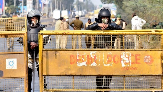 Security tightened during an ongoing farmer's protest against the new farm laws, at the Singhu border in New Delhi on Thursday. (ANI Photo) Security tightened during an ongoing farmer's protest against the new farm laws, at the Singhu border in New Delhi on Thursday. (ANI Photo)