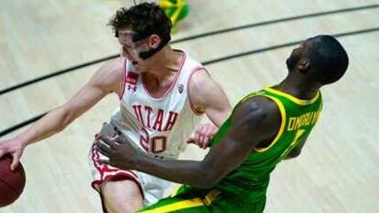 Utah forward Mikael Jantunen (20) collides with Oregon forward Eugene Omoruyi (2) during the second half of an NCAA college basketball game Saturday, Jan. 9, 2021, in Salt Lake City. (AP Photo/Rick Bowmer) (AP) Utah forward Mikael Jantunen (20) collides with Oregon forward Eugene Omoruyi (2) during the second half of an NCAA college basketball game Saturday, Jan. 9, 2021, in Salt Lake City. (AP Photo/Rick Bowmer) (AP)