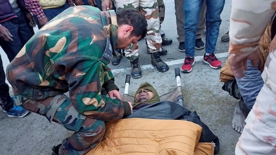 Chamoli: Army Medical Corps official examines a worker rescued from Tapovan Tunnel, after a glacier broke off in Joshimath in Uttarakhand's Chamoli district causing a massive flood in the Dhauli Ganga river. More than 150 labourers working at the Rishi Ganga power project may have been directly affected. (PTI Photo) Chamoli: Army Medical Corps official examines a worker rescued from Tapovan Tunnel, after a glacier broke off in Joshimath in Uttarakhand's Chamoli district causing a massive flood in the Dhauli Ganga river. More than 150 labourers working at the Rishi Ganga power project may have been directly affected. (PTI Photo)