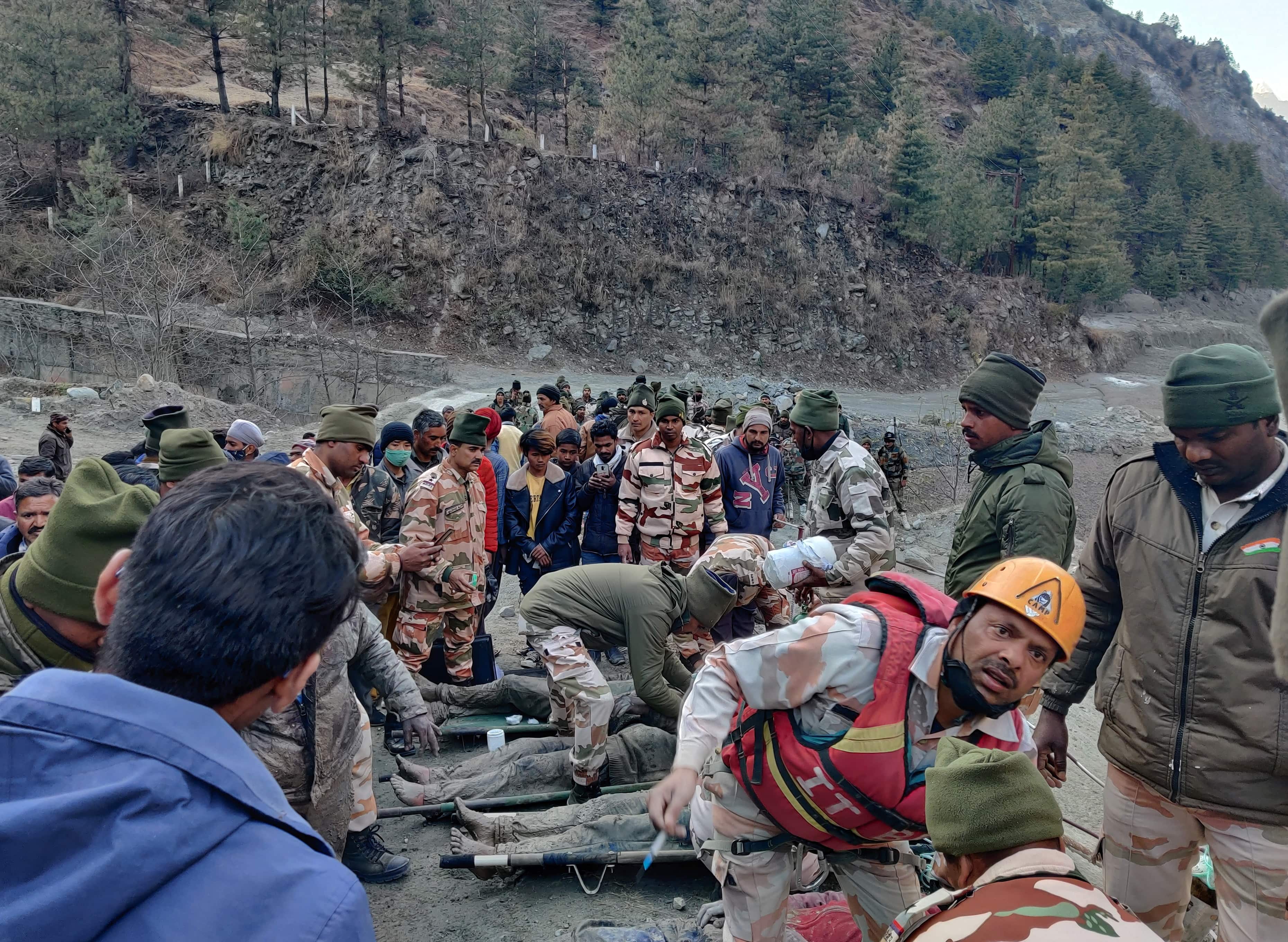 Members of Indo-Tibetan Border Police (ITBP) tend to people rescued after a Himalayan glacier broke and swept away a small hydroelectric dam, in Chormi village in Tapovan in the northern state of Uttarakhand. (REUTERS)