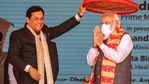 Assam Chief Minister Sarbananda Sonowal, left, greets Indian Prime Minister Narendra Modi by holding a traditional Assamese Japi above his head during a public rally in Dhekiajuli, Assam, India, Sunday, Feb. 7, 2021. (AP) Assam Chief Minister Sarbananda Sonowal, left, greets Indian Prime Minister Narendra Modi by holding a traditional Assamese Japi above his head during a public rally in Dhekiajuli, Assam, India, Sunday, Feb. 7, 2021. (AP)