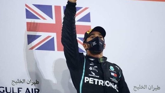 FILE PHOTO: Mercedes' Lewis Hamilton celebrates on the podium. (Pool via REUTERS)