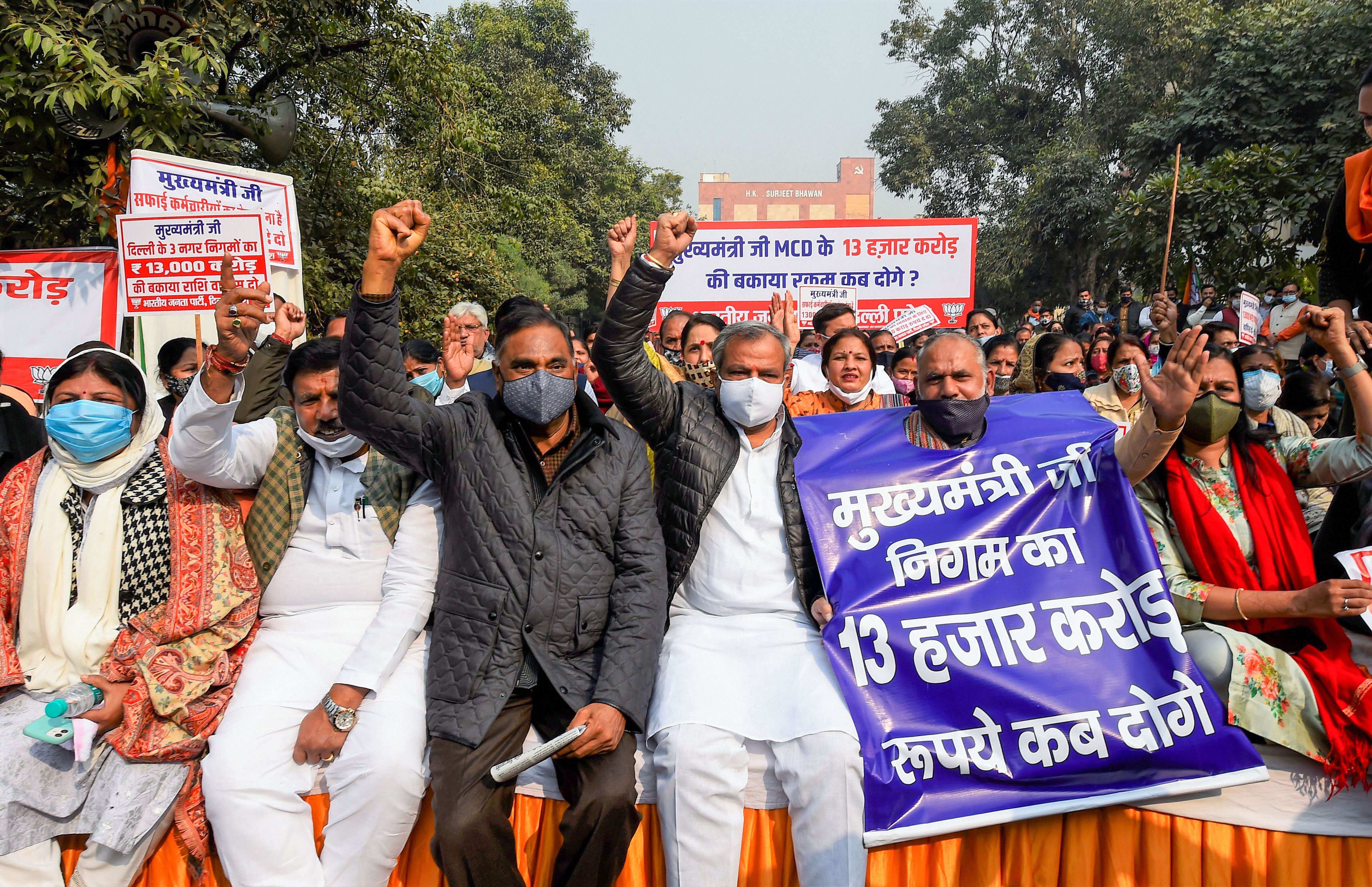 New Delhi: Delhi BJP President Adesh Gupta with Leader of Opposition in Delhi Assembly Ramvir Singh Bidhuri and party councillors stages a 'Satyagrah' protest demanding the release of the due fund of corporations, near APP office in New Delhi in December 2020. (PTI file photo)