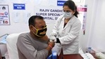 A healthcare worker inoculates a staff member with a Covid-19 vaccine at Rajiv Gandhi Super speciality hospital in New Delhi on February 9, 2021.(AFP Photo) A healthcare worker inoculates a staff member with a Covid-19 vaccine at Rajiv Gandhi Super speciality hospital in New Delhi on February 9, 2021.(AFP Photo)