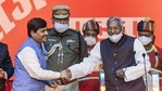 Bihar Governor Phagu Chauhan congratulates Syed Shahnawaz Hussain after taking oath.(PTI) Bihar Governor Phagu Chauhan congratulates Syed Shahnawaz Hussain after taking oath.(PTI)