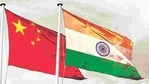 China India national flag cloth fabric waving on the sky with beautiful sun light - Image (Shutterstock) China India national flag cloth fabric waving on the sky with beautiful sun light - Image (Shutterstock)