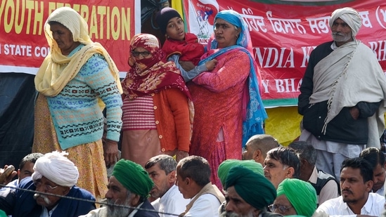 Farmers raise slogans during an ongoing protest against the new farm laws, at the Tikri border in New Delhi on Tuesday. (ANI Photo) Farmers raise slogans during an ongoing protest against the new farm laws, at the Tikri border in New Delhi on Tuesday. (ANI Photo)