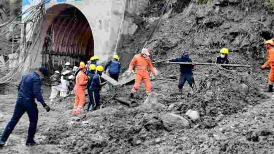 NDRF, SDRF, ITBP and army personnel carrying out search and rescue operation while clearing the debris of a tunnel after the glacier burst in Chamoli, Uttarakhand. (ANI) NDRF, SDRF, ITBP and army personnel carrying out search and rescue operation while clearing the debris of a tunnel after the glacier burst in Chamoli, Uttarakhand. (ANI)