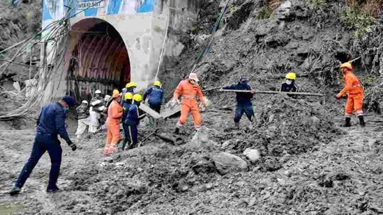 NDRF, SDRF, ITBP and army personnel carrying out search and rescue operation while clearing the debris of a tunnel after the glacier burst in Chamoli, Uttarakhand, on February 8. (ANI) NDRF, SDRF, ITBP and army personnel carrying out search and rescue operation while clearing the debris of a tunnel after the glacier burst in Chamoli, Uttarakhand, on February 8. (ANI)