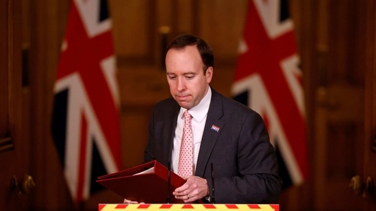 Britain's Health Secretary Matt Hancock leaves after attending a virtual press conference inside 10 Downing Street in central London on February 8, 2021, to give an update on the coronavirus covid-19 pandemic. - Undocumented migrants in Britain will still be able to get Covid vaccines without being subject to status checks, the government said on Monday. (Photo by Tolga Akmen / various sources / AFP)(AFP)