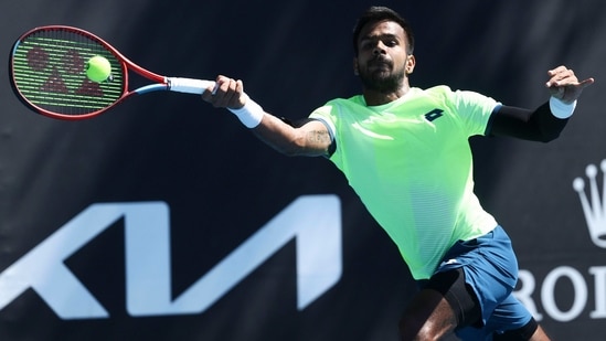 India's Sumit Nagal makes a forehand return to Lithuania's Ricardas Berankis during their first-round match at the Australian Open (AP) India's Sumit Nagal makes a forehand return to Lithuania's Ricardas Berankis during their first-round match at the Australian Open (AP)