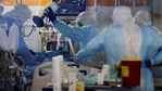 Medical staff, seen through the window of an observation room, wear personal protective equipment (PPE) while working inside an underground ward treating patients with coronavirus infection (COVID-19) at Unit Coronavirus Critical Care at Sheba Medical Center in Ramat Gan, Israel February 8, 2021. Photo taken February 8, 2021. REUTERS / Ronen Zvulun (REUTERS)