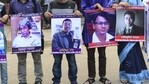 Protesters mourn the death of (from Lto R) Humayun Azad, Abhijit Roy, Faisal Arefin Dipan and Nazimuddin Samad who were killed by religious hardliners in a wave of violence between 2013 and 2016 which secular activists, bloggers and atheist writers. (AFP File)
