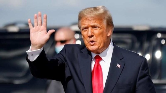 Former US President Donald Trump waves as he arrives at Palm Beach International Airport in West Palm Beach, Florida, US. (Reuters)