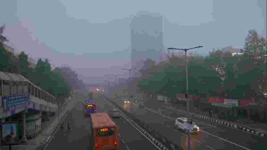 Vehicles move amid the dense fog with low visibility as the air quality decreases, in New Delhi on Sunday. (ANI Photo) Vehicles move amid the dense fog with low visibility as the air quality decreases, in New Delhi on Sunday. (ANI Photo)