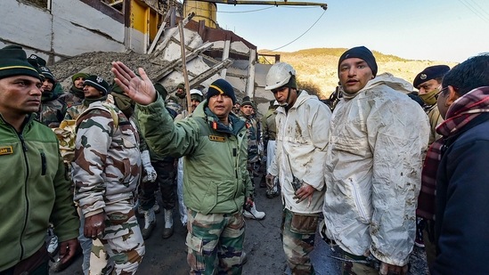 Armed forces personnel discuss rescue strategies near the Tapovan tunnel on February 8. A meeting of all agencies including senior officials of ITBP, NDRF, Army and local administration has been called on February 10 to decide further course of action.(Arun Sharma / PTI)