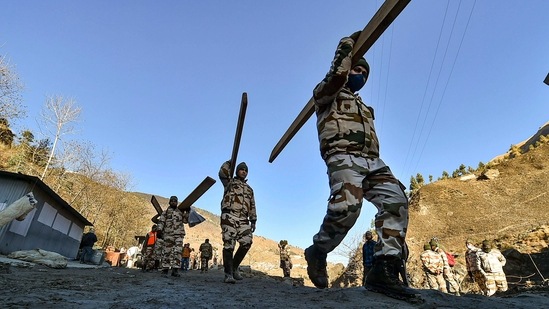 ITBP personnel at work during rescue operations in Chamoli on February 8. The police have issued a helpline number to provide information about bodies that have not been identified yet. "People, who know someone who is missing, can contact DIG Law and Order on +91 7500016666, they will be sent photos of 24 bodies that are yet to be identified, on WhatsApp," police said.(Arun Sharma / PTI)